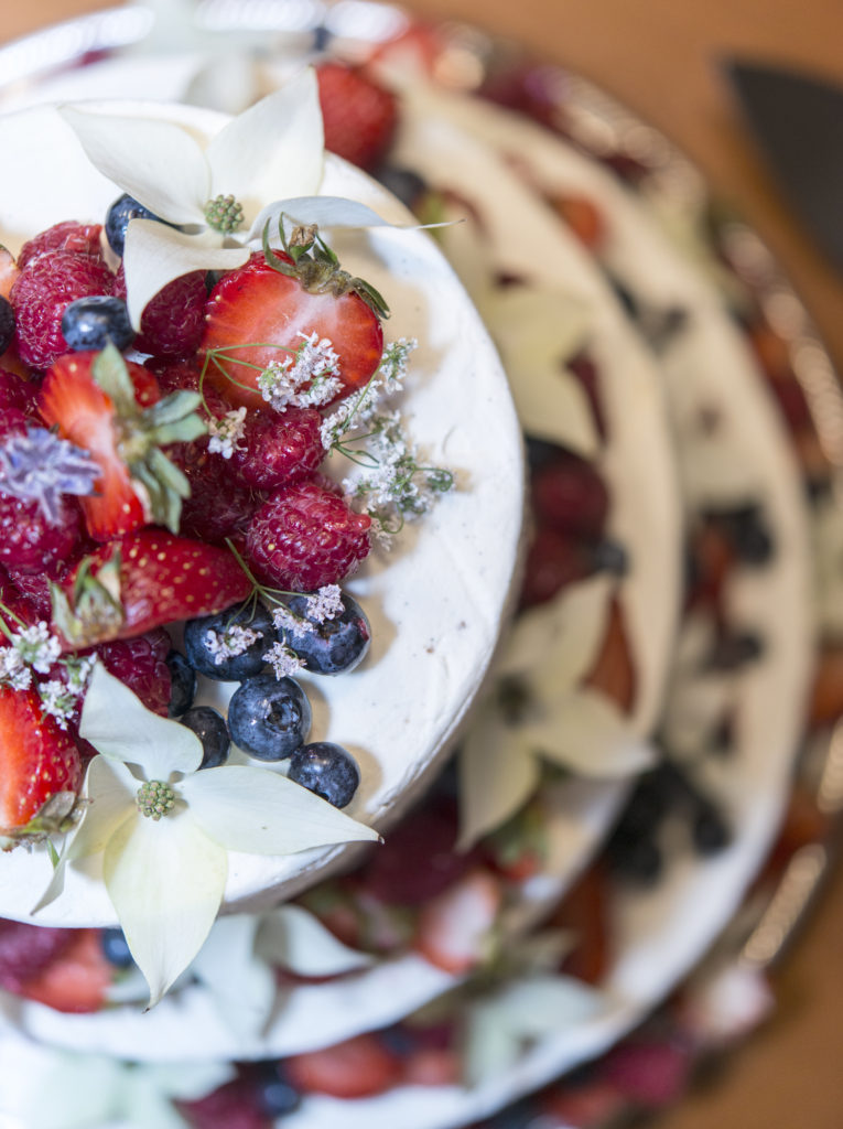 vanilla wedding cake with lemon curd, strawberry jam & fresh berries